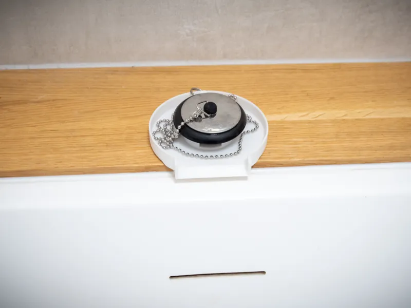 Bath plug holder plate