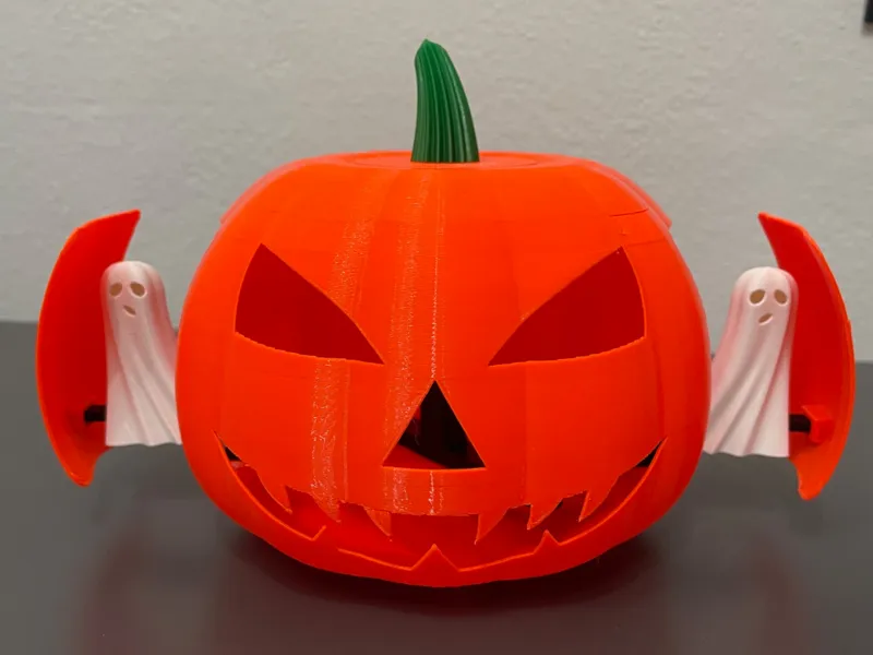 Halloween pumpkin with sliding ghosts