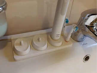 Oral B triple charger base with brush holder