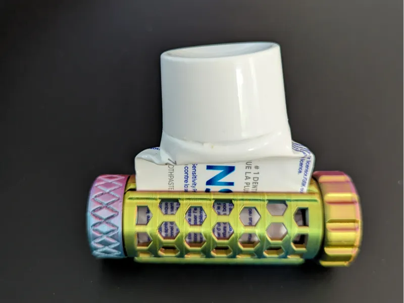 Toothpaste squeezer with metal tube suppport
