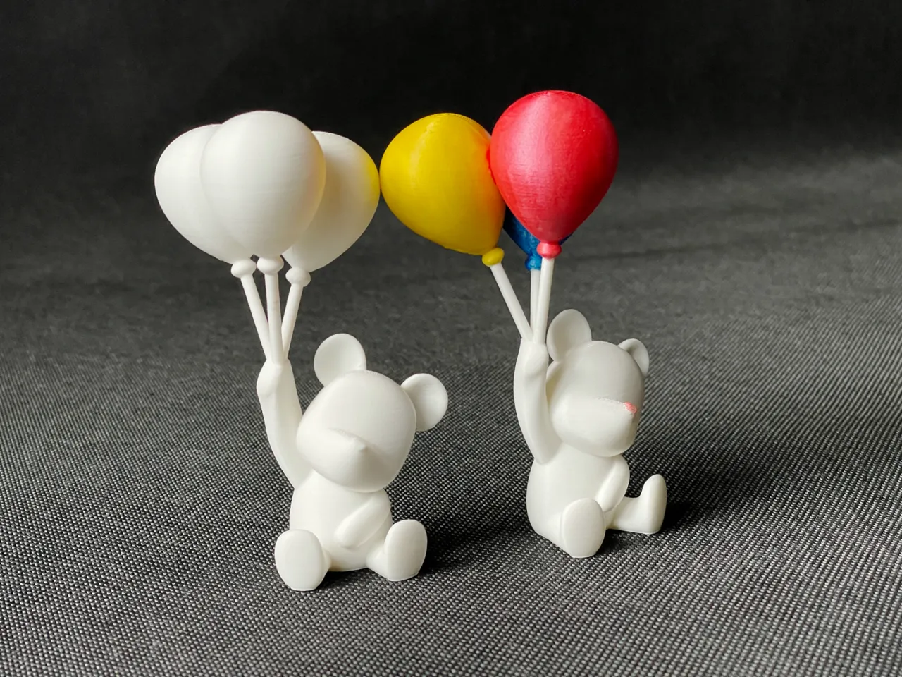 Polar bear holding balloons view 2