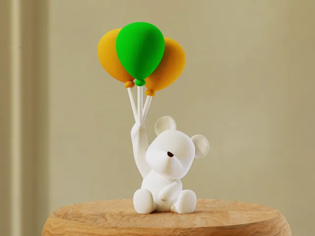 Polar bear holding balloons