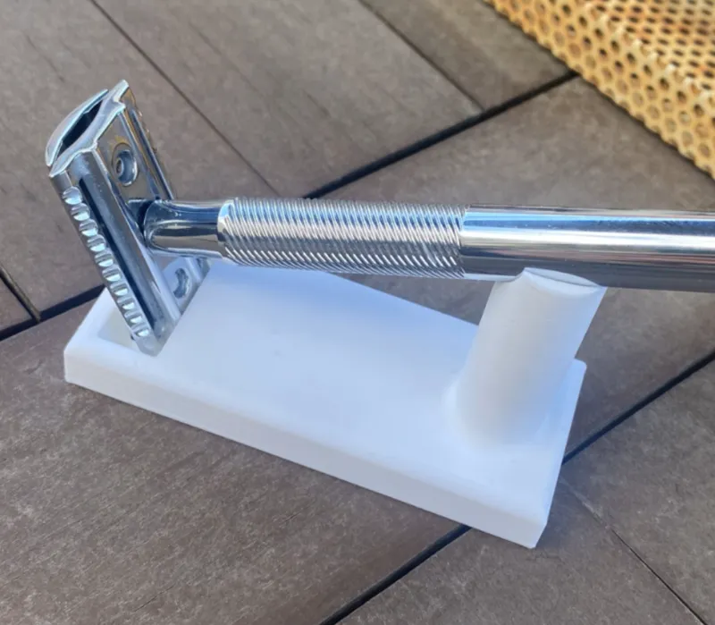 Minimalist Razor Stand with drainage holes.