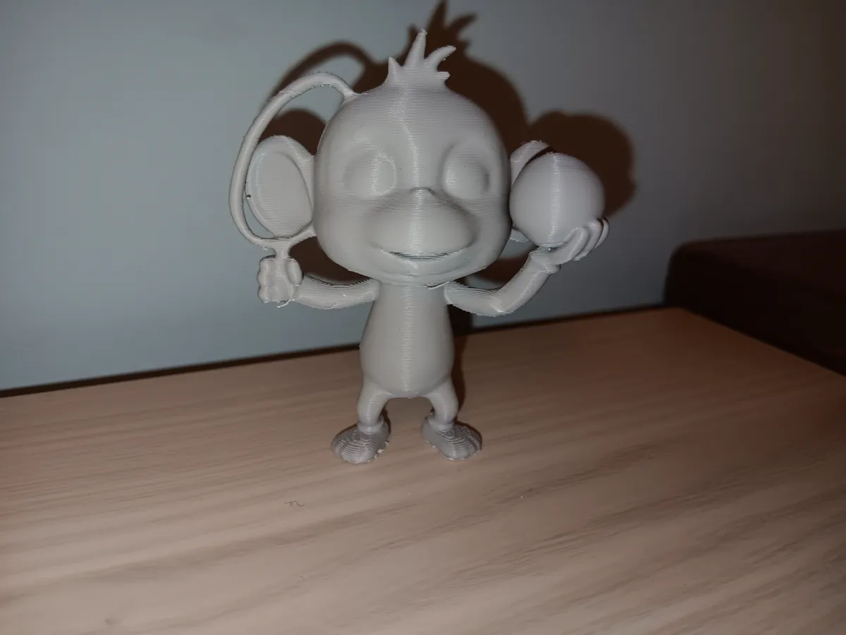 Figurine singe joueur de tennis
