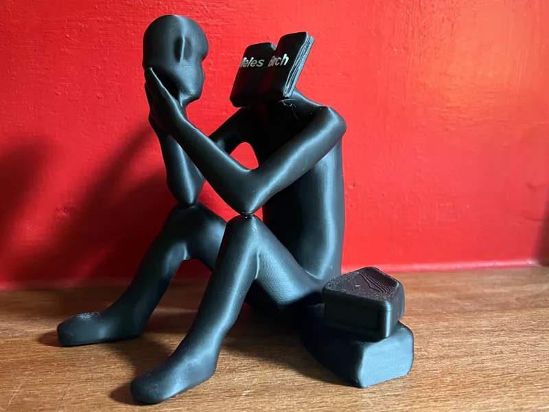Figur - Die Last des Wissens