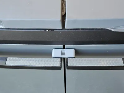 Trash bin door lock