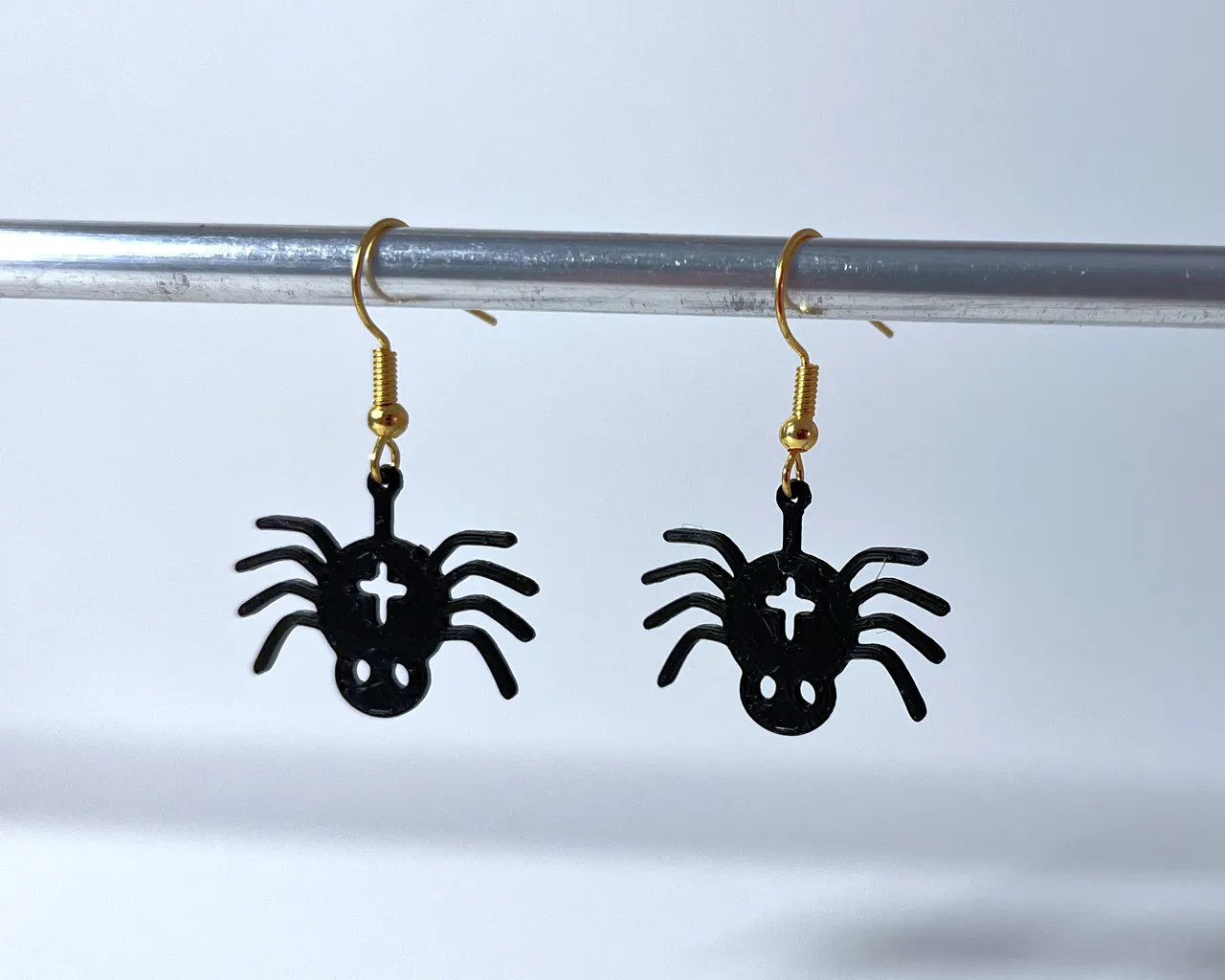 Halloween spider earrings with gift background view 4