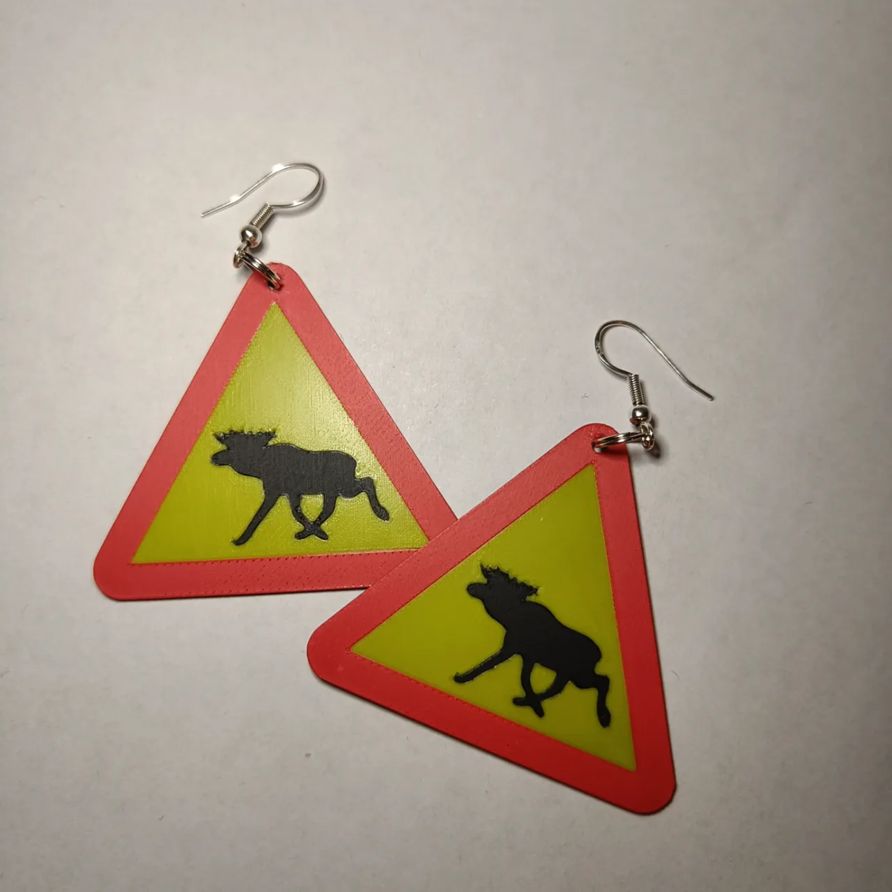 Warning for the swedish moose earrings/keychain view 3