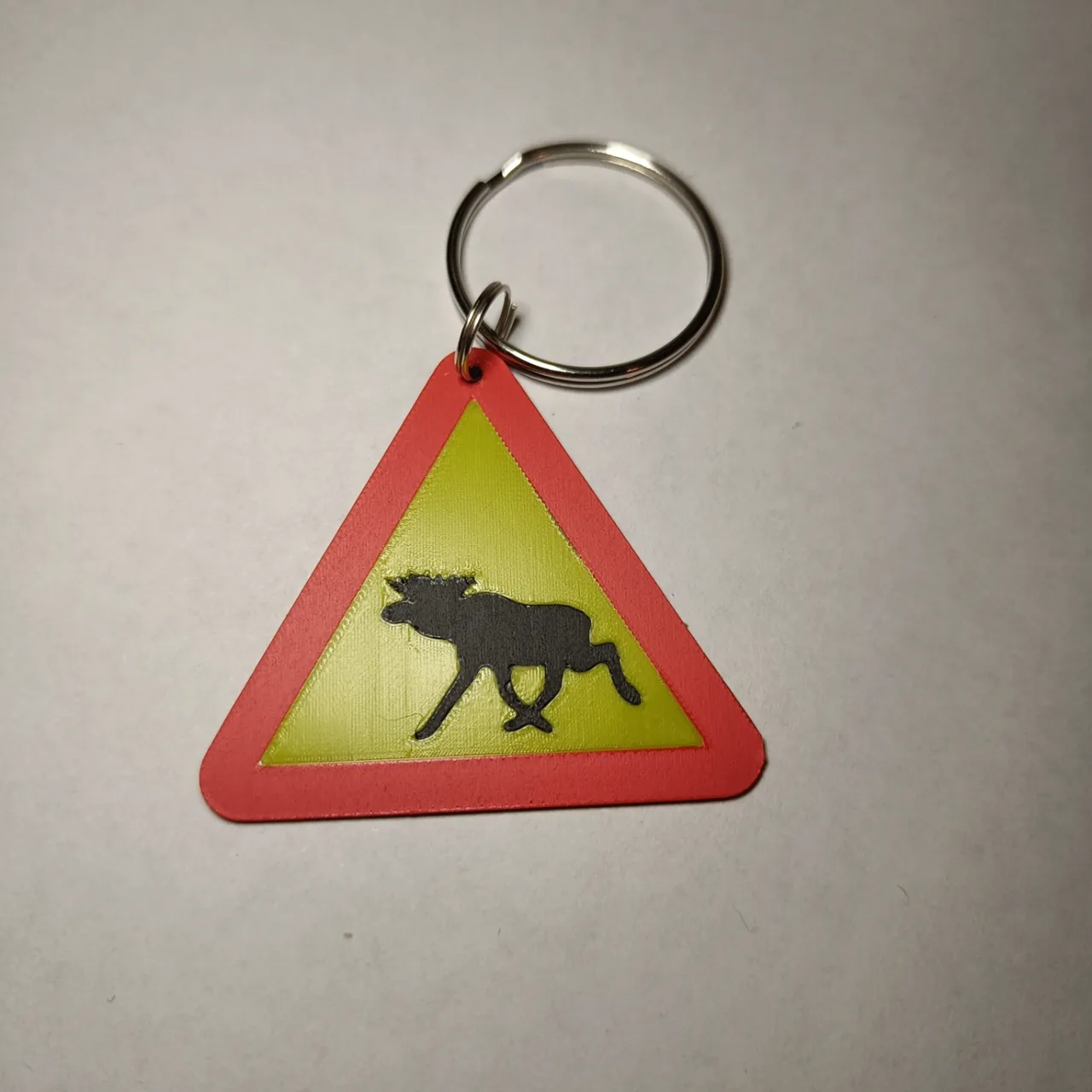 Warning for the swedish moose earrings/keychain view 4