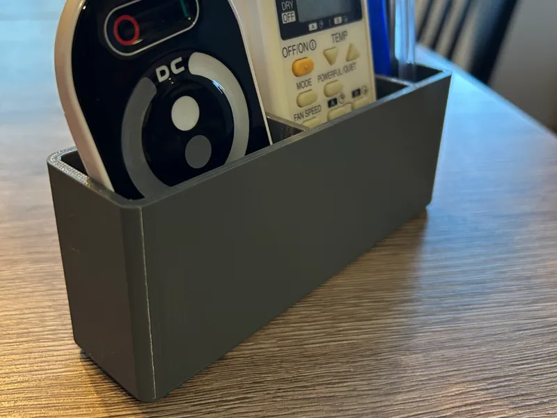 Wall mountable remote control holder