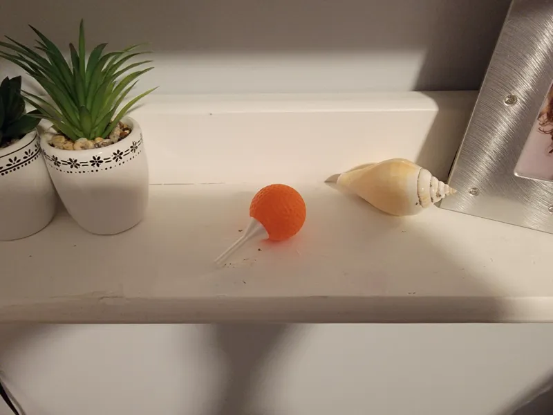 Miniature Golf Ball on a Tee