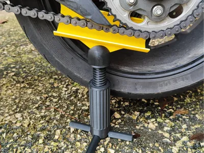 Motorcycle chain lubrication protection stand