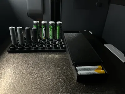 Battery holder with a slide