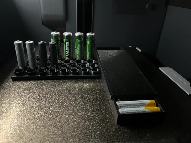 Battery holder with a slide