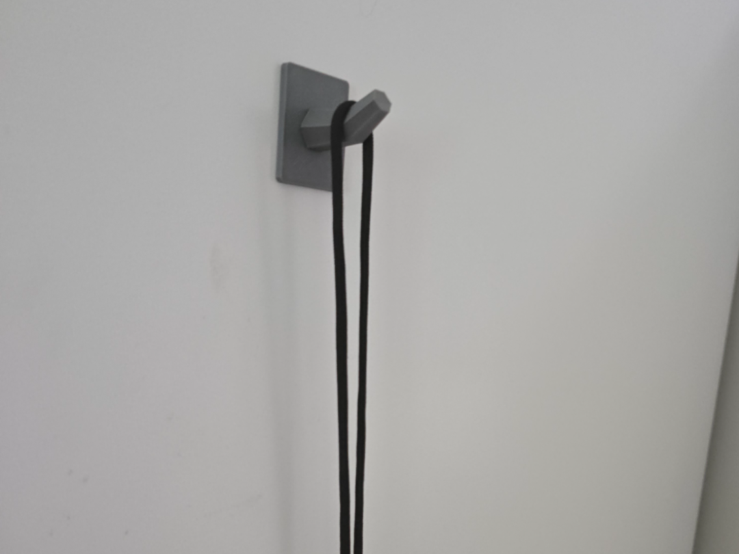 Simple magnetic hook for keys, lanyards, etc.