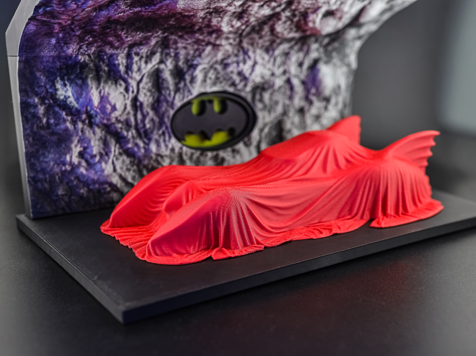 Batman returns - Covered Batmobile in a cave
