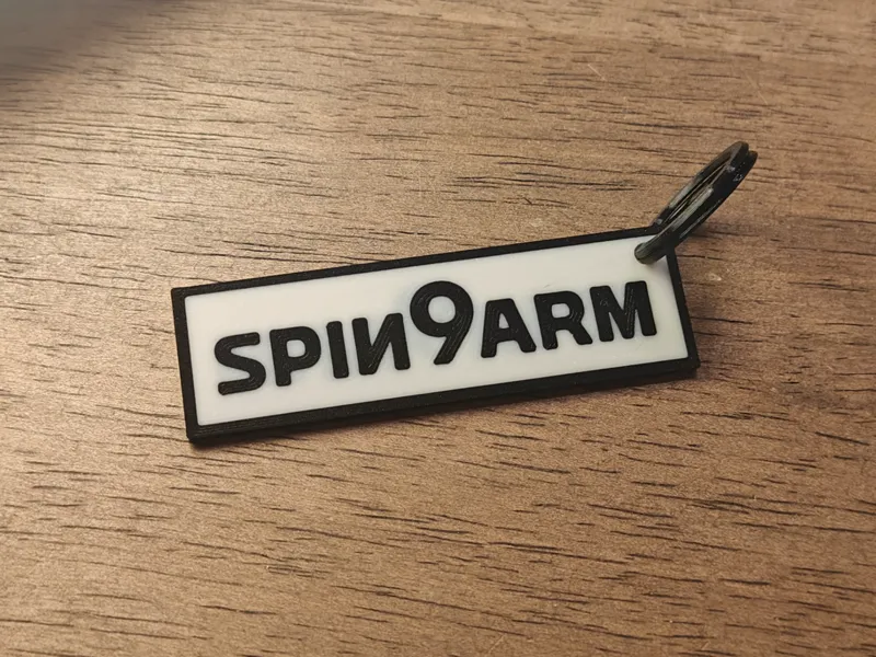spin9arm keychain