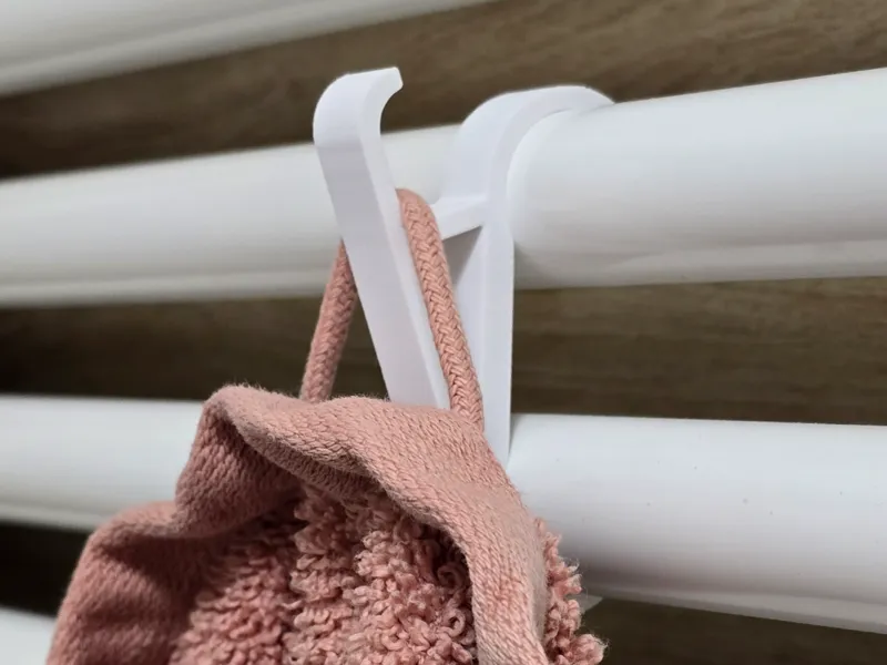 Towel hanger for bathroom radiator