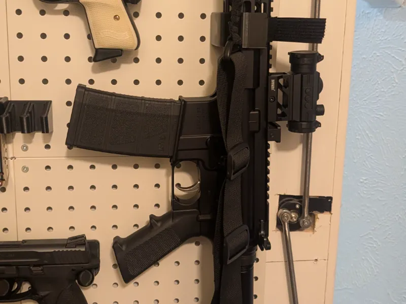 AR rifle pegboard mount