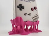 Поставка за Game Boy DMG с дизайн на разтопена дъвка