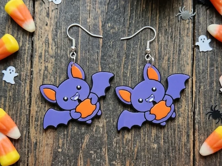 Pendientes: Cute Bat Holding Pumpkin Earrings. Referencia del modelo original.