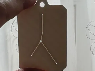 A keychain with the Cancer constellation