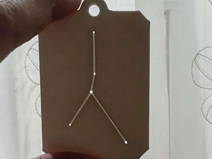 A keychain with the Cancer constellation