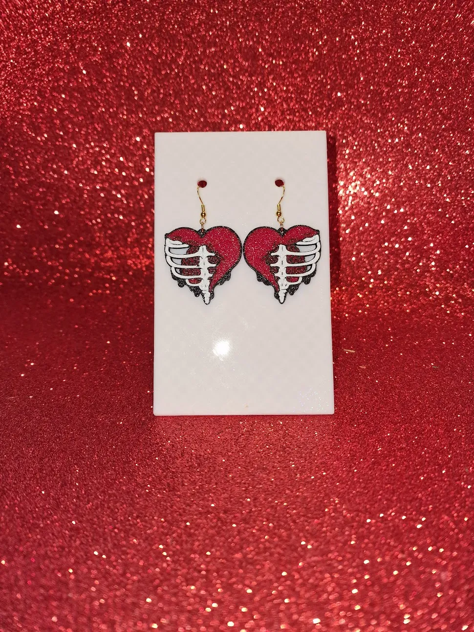Skeleton heart earrings view 2