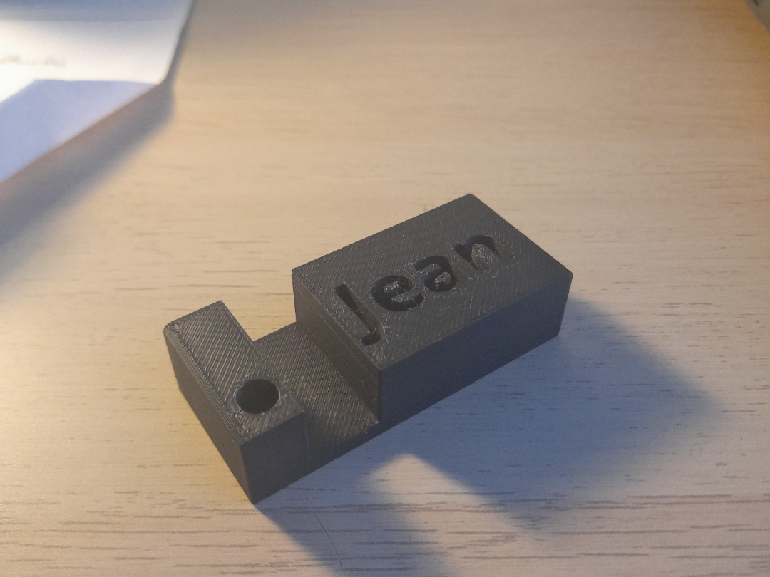 support téléphone porte clés