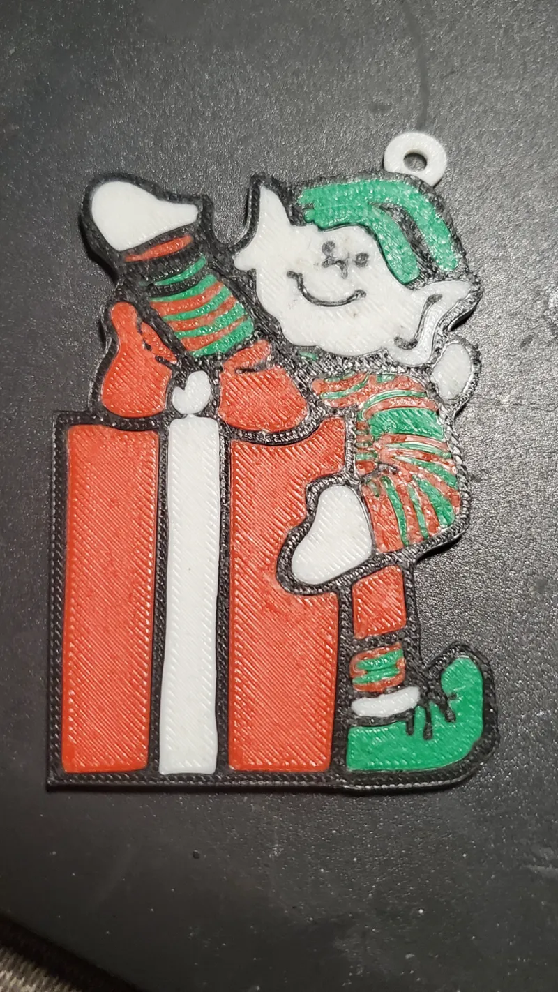 The happy waving Christmas Elf