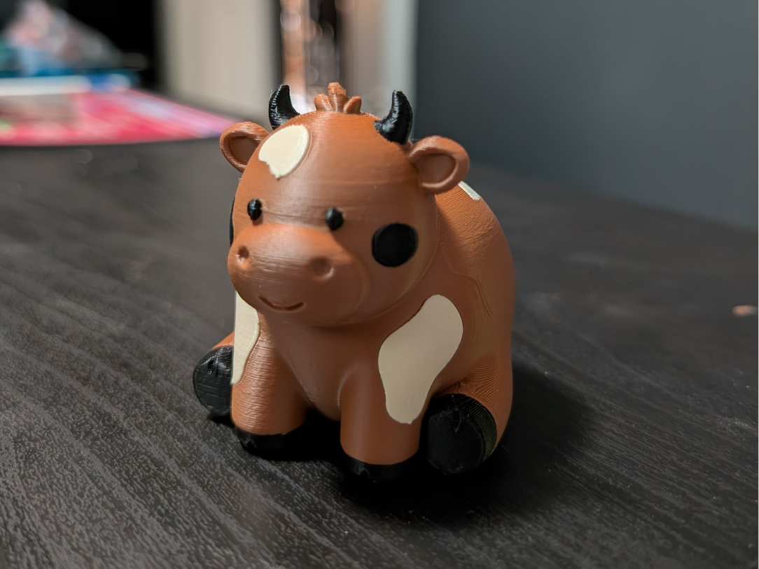 Cute Cow sitting down