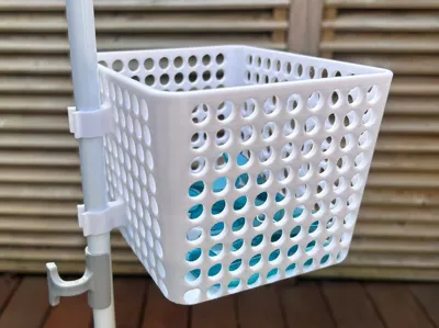 Storage bin for vertical clothes drying rack