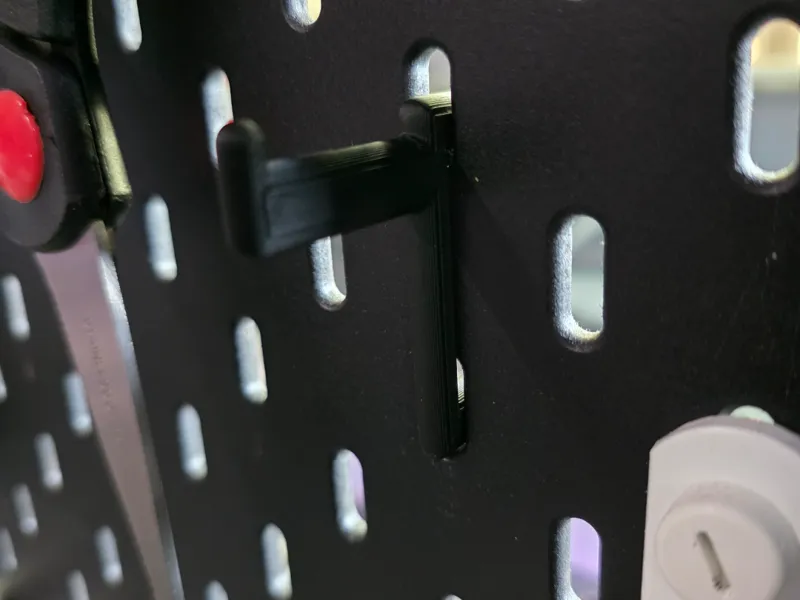 IKEA Skadis hook to hold a roll of electrical tape