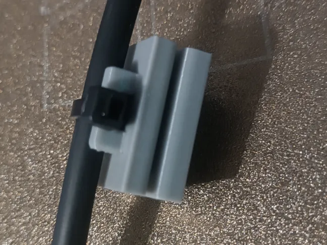 Cable holder for solar panel frame