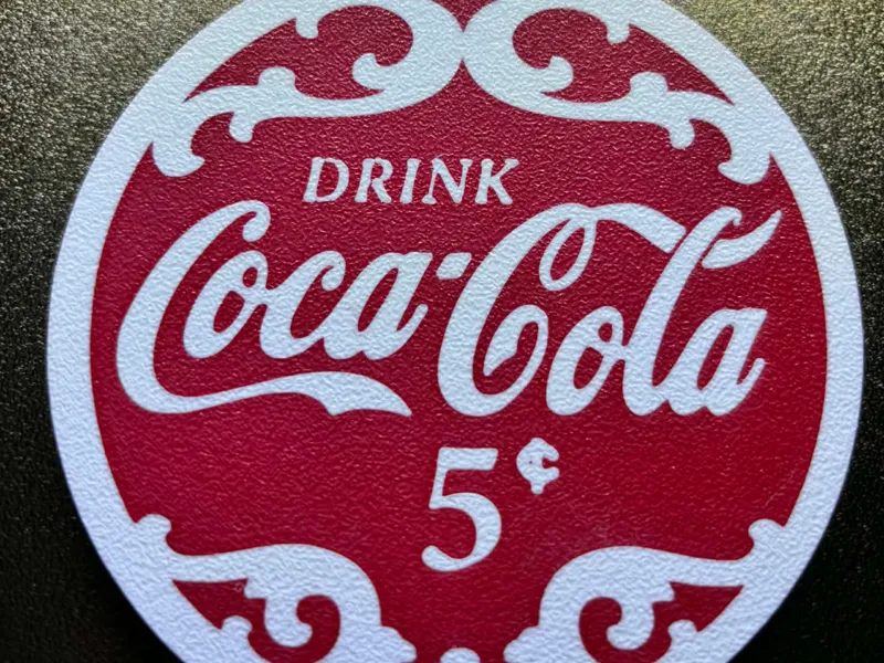 cola coaster white lettering