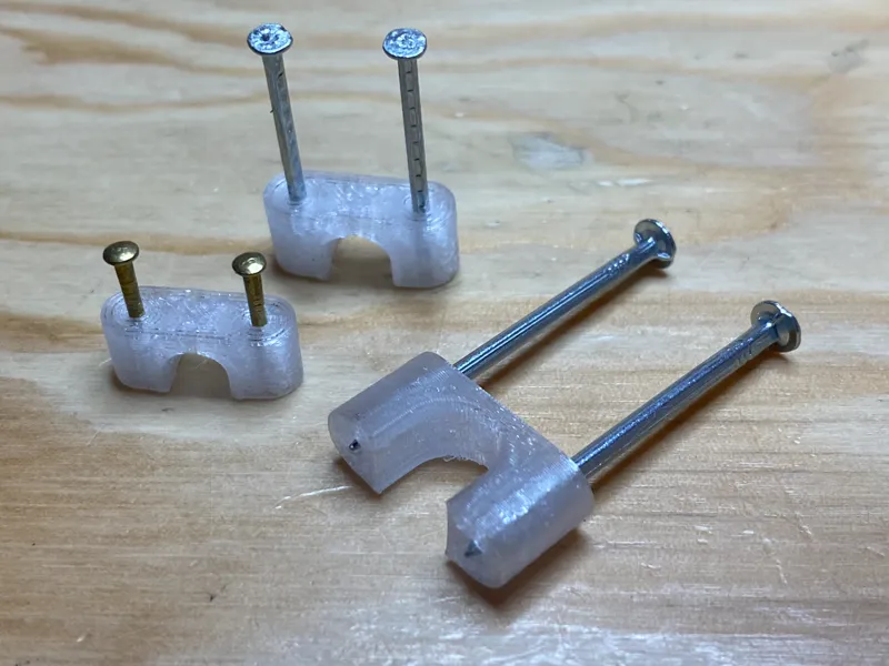 Double nail cable clip