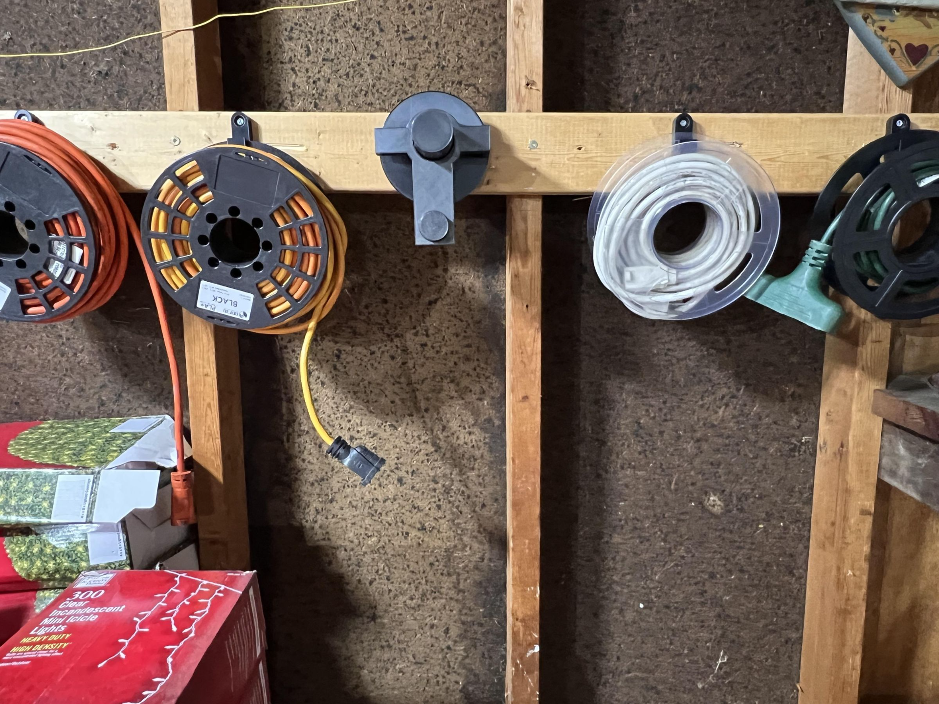 Extension cord and christmas light storage system