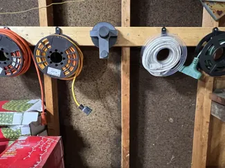 Extension cord and christmas light storage system
