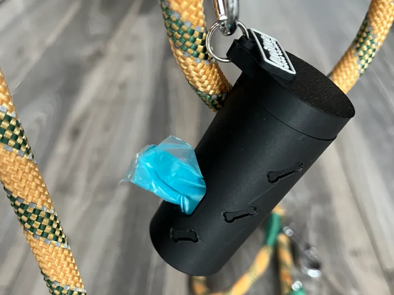 Dog poop bag container with geometric pattern