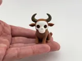 Миниатюрна фигурка на бик с череп