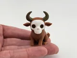 Миниатюрна фигурка на бик с череп