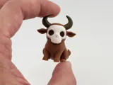 Миниатюрна фигурка на бик с череп