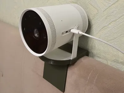 Stand for Samsung Freestyle 2 on the headboard
