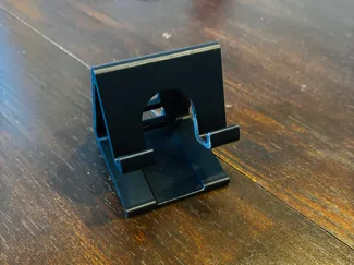 PlugPerch- a phone stand for a table or wall plug