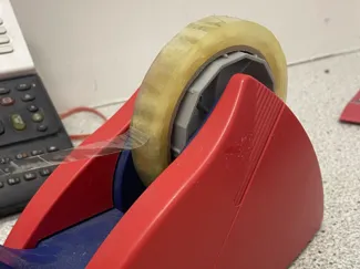 Adhesive tape dispenser