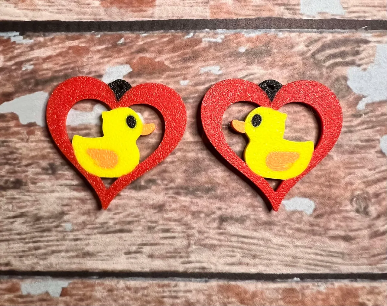 Rubber duck cutout heart earrings view 2