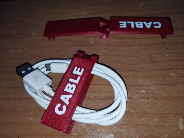 Clip range-câbles pour bureau