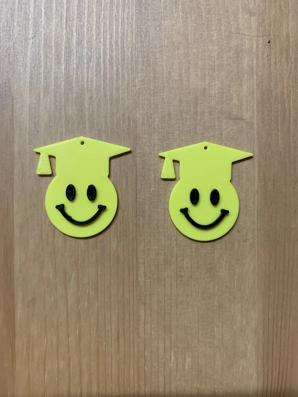 graduation emoji earrings view 2