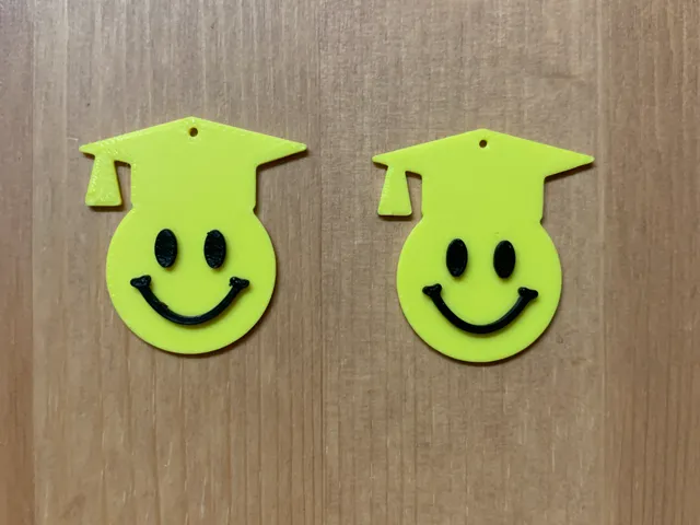 graduation emoji earrings