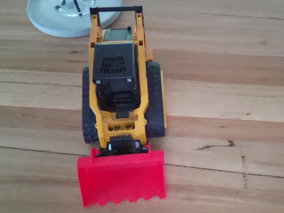 Godet à dents pour mini-chargeuse Bruder